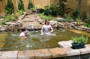 Hannah and Wyatt cool off in their beautiful wading pool.