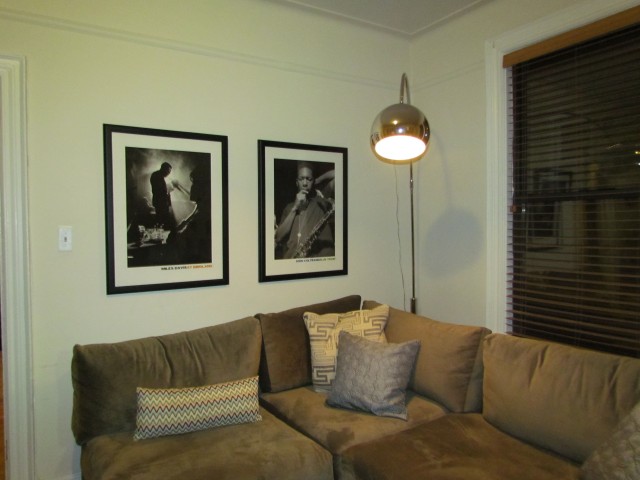 New sofa, new lamp and artwork reused in a different place.